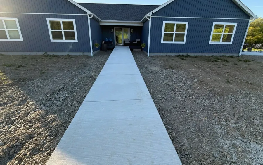 Unfinished front yard before planting, seeding and cobblestone edging