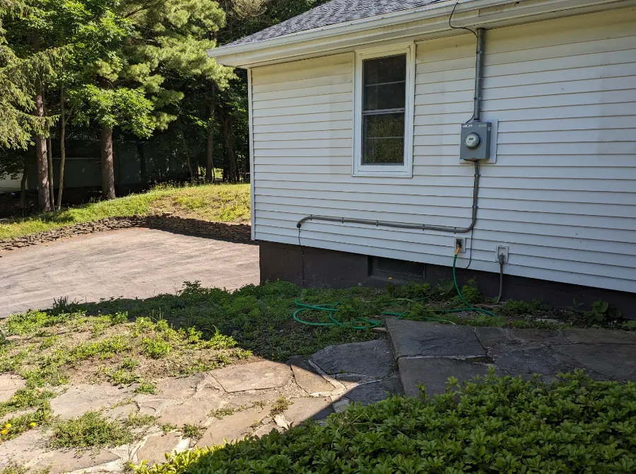 Front yard before a landscape redesign in Hamburg, NY