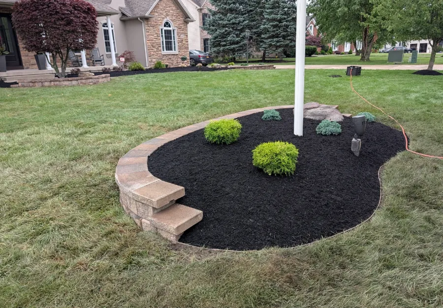 Island bed with a new landscape wall and plantings in Grand Island, NY