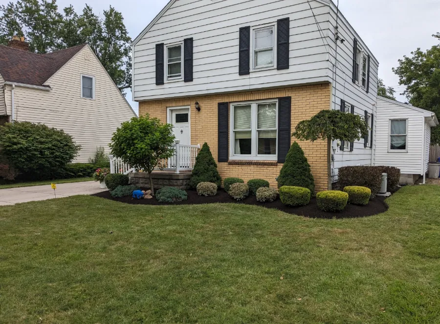 The same beds after fresh mulch and shrub trimming